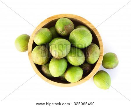 Chebulic Myrobalans In Wood Bowl Isolated On White Background, Herb And Medical