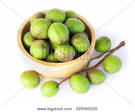 Chebulic Myrobalans In Wood Bowl Isolated On White Background, Herb And Medical