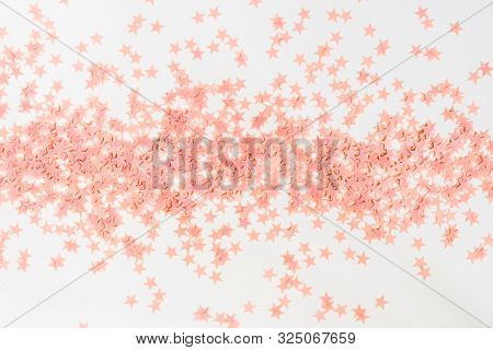Pastel Pink Confetti Stars On A White Background. Holiday Party Concept