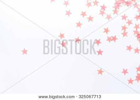 Pastel Pink Confetti Stars On A White Background. Holiday Party Concept