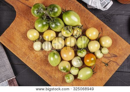 Green Fresh Tomato On A Wooden Kitchen Board, Vegetarian Food, Healthy Nutrition, Fresh Tomatoes