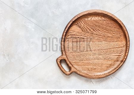 Empty Round Wooden Dish On Grey Concrete Background, Copy Space For Your Text