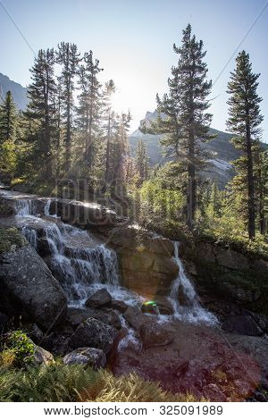 A Beautiful Waterfall In The Forest. Wildlife, Waterfalls In A Deserted Forest. Taiga. Strong And Ta