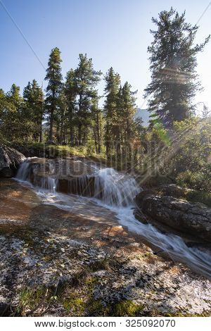 A Beautiful Waterfall In The Forest. Wildlife, Waterfalls In A Deserted Forest. Taiga. Strong And Ta