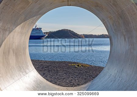 Looking Throgh Big Concrete Pipe Construction At Sea
