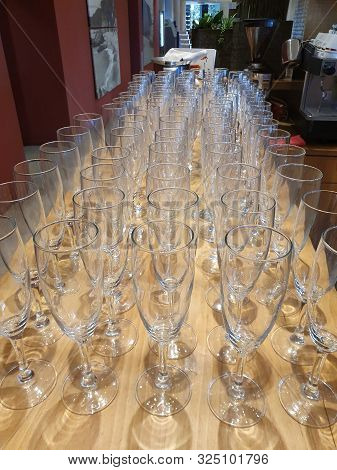 Empty Glasses Of Champagne On The Bar Table.