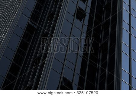 Wall Of High Black Futuristic Glass Building