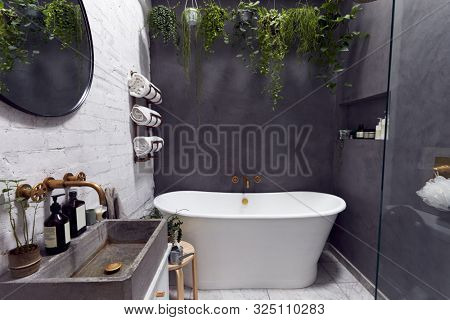 Empty Interior Of Contemporary Bathroom With Free Standing Bath