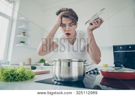 Close-up Portrait Of His He Nice Attractive Overwhelmed Clueless Puzzled Guy Making Dinner Lunch Loo