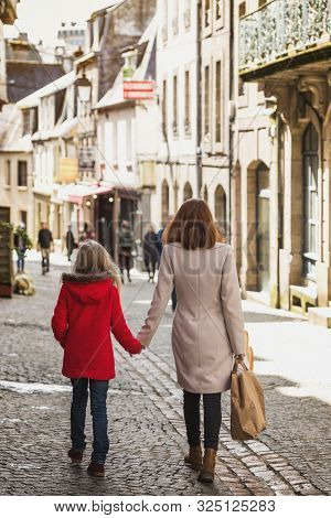 Happy Mother And Daughter At The City