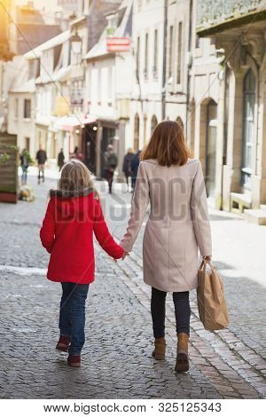 Happy Mother And Daughter At The City
