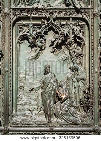 Ornate Detail Of The Bronze Door Of Milan Catehdral In Italy