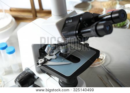 Modern Microscope On Table In Laboratory. Phytopathological Analysis