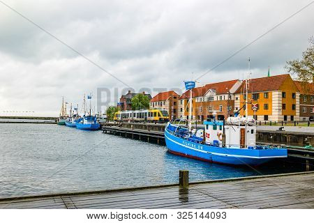 Helsingor, Denmark - May, 2019: Street View With Colorful Buildings, Ships And Tram In Helsingor, De