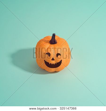 Halloween Holiday Creative Background With Jack O Lantern Glitter Pumpkin