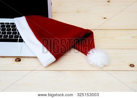 Laptop With Blank Screen And Santa Slaus Hat