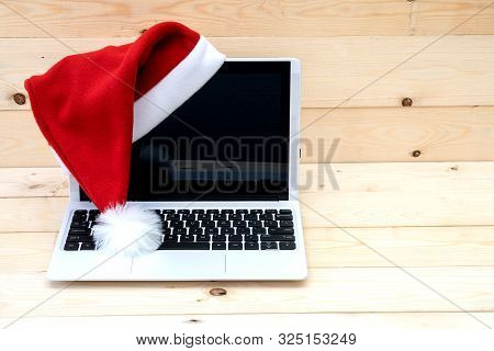 Laptop With Blank Screen And Santa Slaus Hat