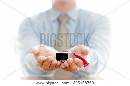 A Businessman Hold Cap Eudcation Concept, University