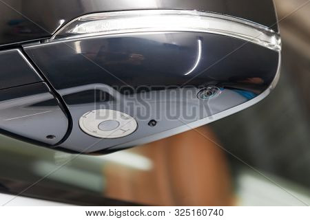Close-up Of The Side Left Mirror With Turn Signal Repeater, Rear Veiw 3d Camera And Window Of The Ca