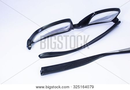 Image Of A Broken Eyeglass Or Spectacle Or Reading Glass Frame With White Background