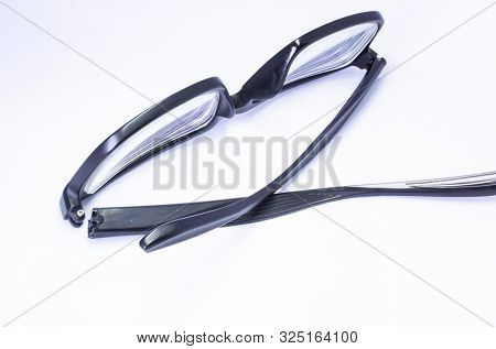 Image Of A Broken Eyeglass Or Spectacle Or Reading Glass Frame With White Background