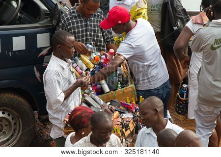 Kampala, Uganda - October 03, 2012.  A Man Sells Wallets To Passengers At The Taxi Park In Kampala, 