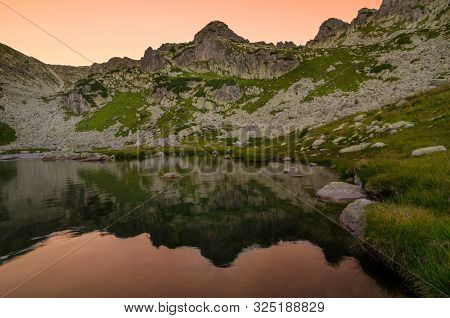 Mountain Landscape And Glacial Taul Portii Lake In Retezat National Park, Carpathian Mountains, Roma