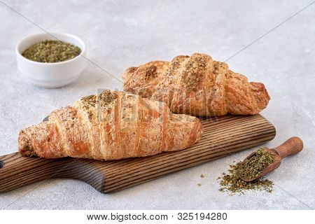 Fresh Croissants With Zaatar On Wooden Board