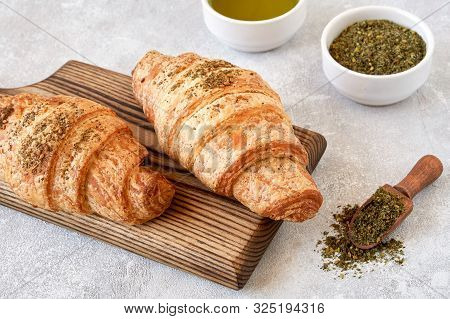 Fresh Croissants With Zaatar On Wooden Board