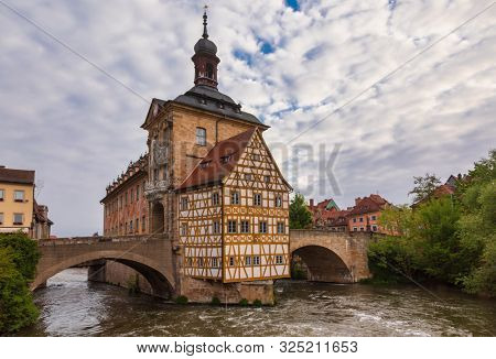 Bamberg cityscape with the medieval Altes Rathaus (Old Town Hall) and stone bridge  over the Regnitz river, Bavaria, Germany, Europe. Bamberg is one of most popular travel destinations in Germany