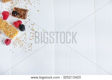 Granola For Weight Loss With Raspberry Berries. Background For Text With Fitness Bars And Raspberrie