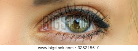 Letterbox View Of Amazing Emerald Wide Opened Left Eye With Contact Lens Of Mature Woman With A Tiny