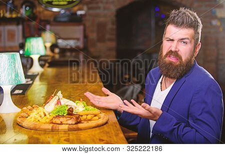 Man Received Meal With Fried Potato Fish Sticks Meat. Delicious Meal. Enjoy Meal. Cheat Meal Concept