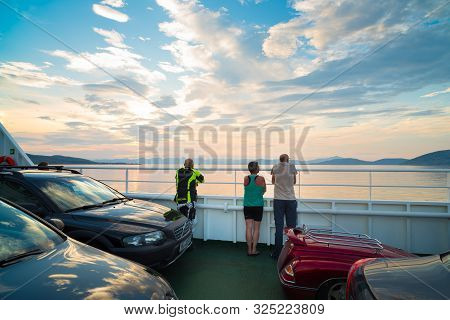 Bognes, Norway - July 31, 2018: People Enjoying The Midnight Sun On The Ferry From Bognes To Skarber
