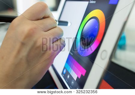 Person About To Draw Something On A Tablet.