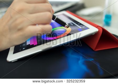 Person About To Draw Something On A Tablet.