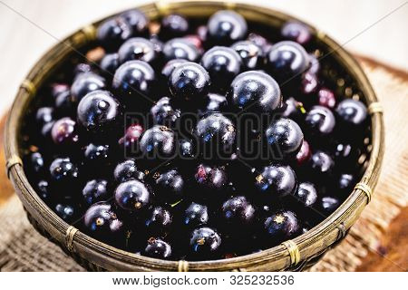 Fruit Called Jaboticaba Or Jabuticaba In A Basket On A White Background, Preserves Organic And Healt