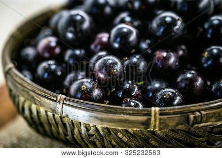 Fruit Called Jaboticaba Or Jabuticaba In A Basket On A White Background, Preserves Organic And Healt