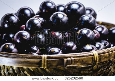 Fruit Called Jaboticaba Or Jabuticaba In A Basket On A White Background, Preserves Organic And Healt