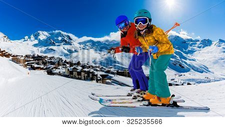 Ski in winter season, view from ski run at mountains and Val Thorens resort in sunny day in France, Alps.