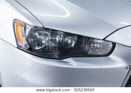 Novosibirsk, Russia - September 07, 2019:  Mitsubishi  Lanser, Macro View Of Modern  Car Xenon Lamp 