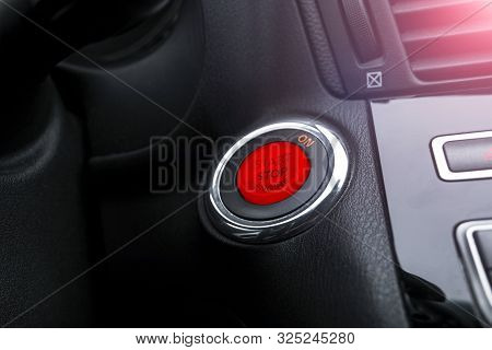 Car Dashboard With Focus On Engine Start Stop Button. Modern Car Interior Details. Start/stop Button
