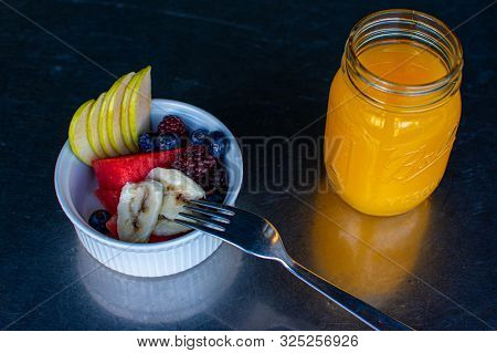 Delicious Red Fruits With Orange Juice
