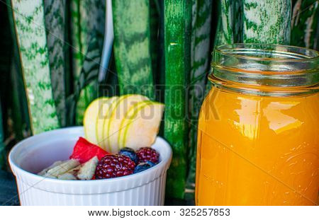 Delicious Red Fruits With Orange Juice