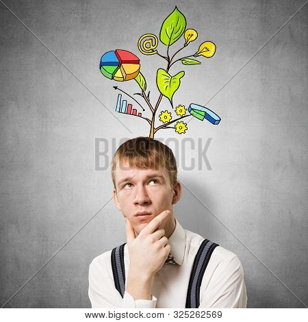 Redhead Student Looks Pensive Upwards And Thinking About Some Genius Idea. Clever Boy With Drawing I