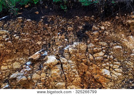 The Curb Erosion From Storms. To Indicate The Layers Of Soil And Rock. Nature Cross Section Soil Und