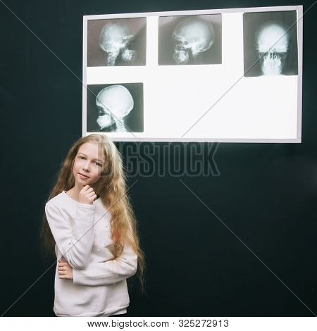 Attentive Detective Girl Looking At The Board With Physical Evi