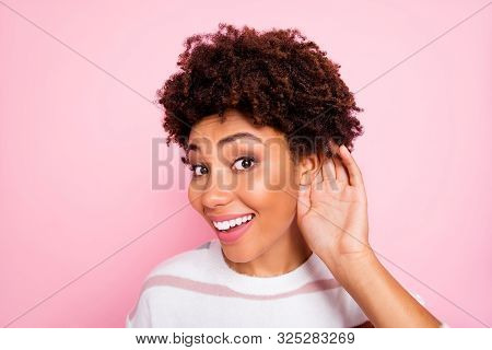 Close Up Photo Of Curly Trendy Cute Sweet Charming Darkish Skinned Lady Smiling Toothily Eavesdroppi