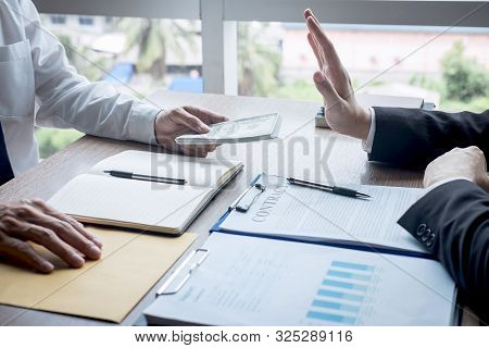 Anti Bribery And Corruption Concept, Business Man Refusing And Don't Receive Money Banknote Offer Fr