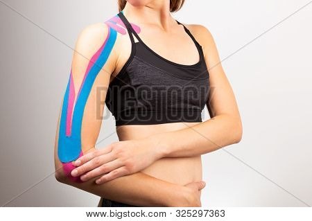 Kinesiotaping, Kinesiology. Female Athlete With Kinesiotape, Muscle Tape On Shoulder